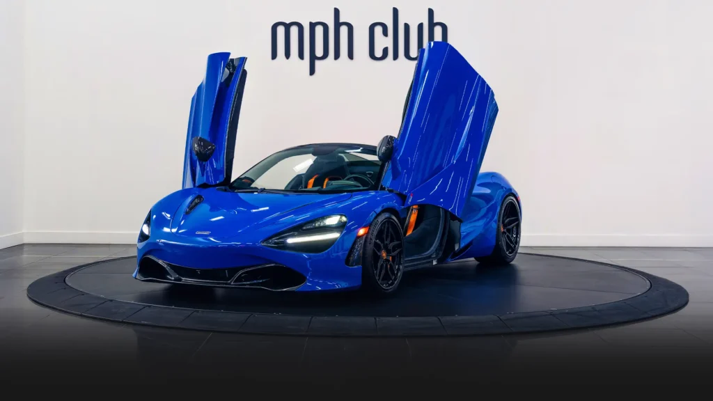 Blue McLaren 720S Spider rental profile view - mph club
