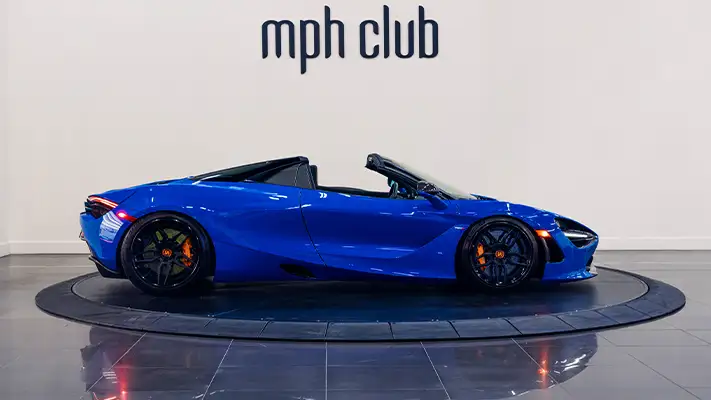 Blue McLaren 720S Spider rental side view - mph club