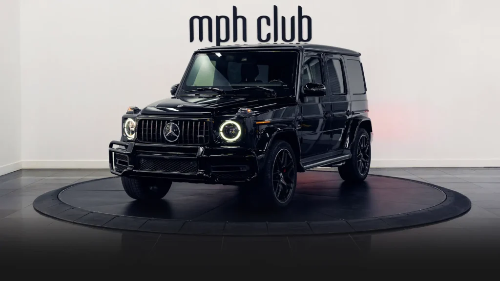 Black on black Mercedes Benz G63 AMG G Wagon rental profile view - mph club