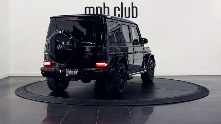 Black on black Mercedes Benz G63 AMG G Wagon rental rear view - mph club