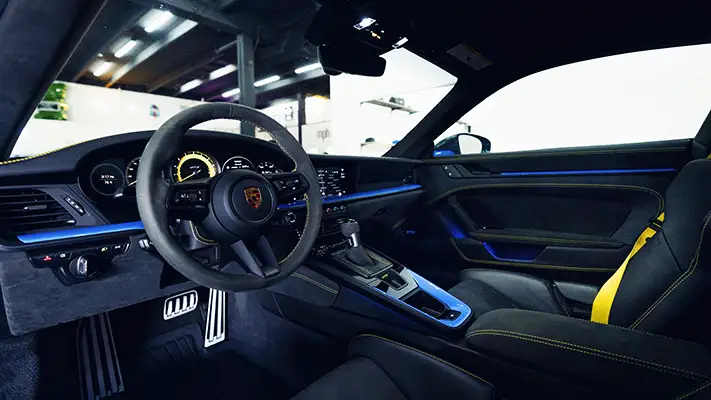 Blue Porsche 911 GT3 rental dashboard view - mph club