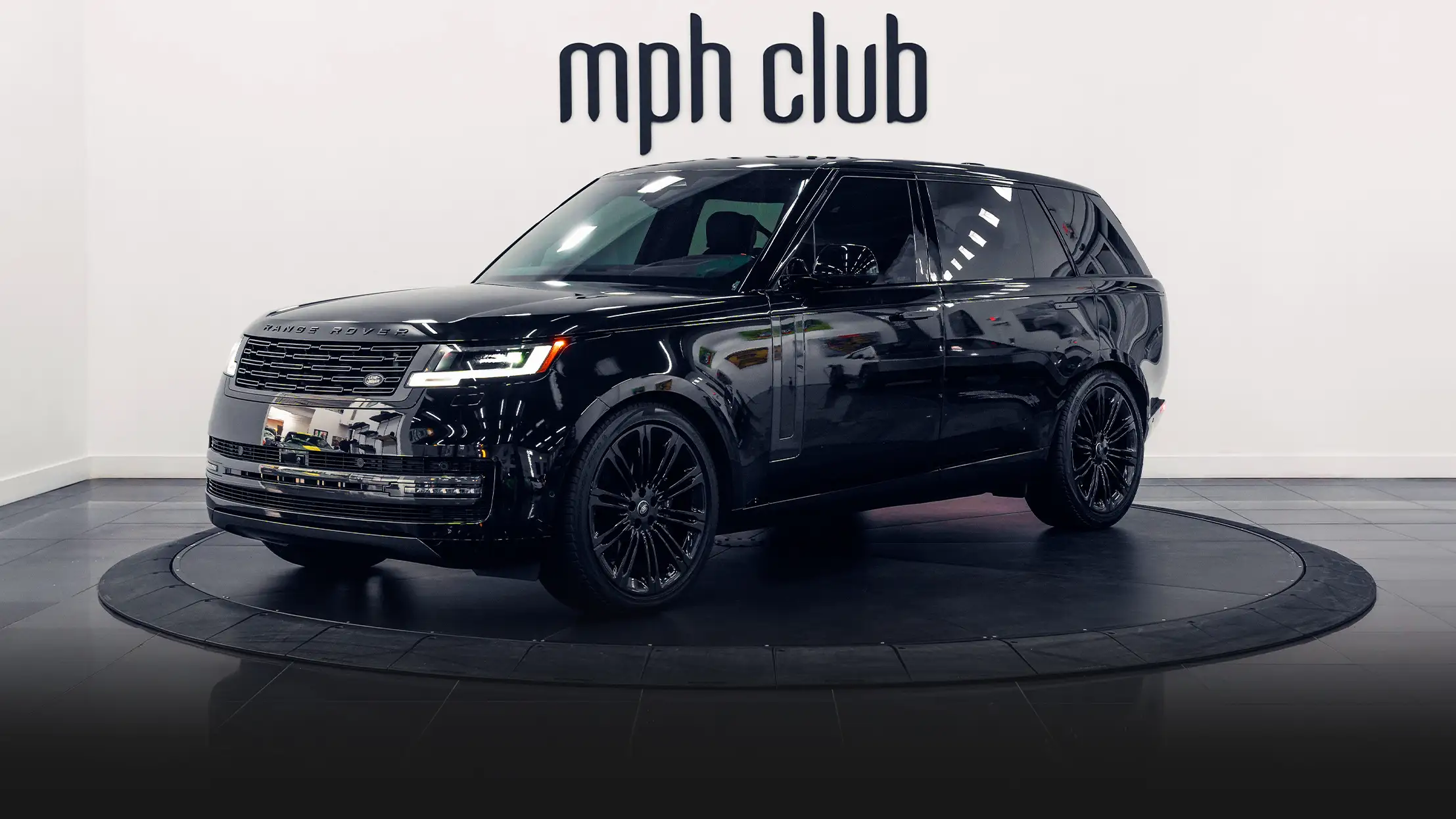 \Black on black Range Rover rental profile view - mph club