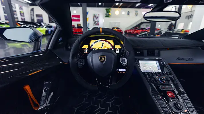 Blue Lamborghini Aventador SV Roadster rental dashboard view - mph club