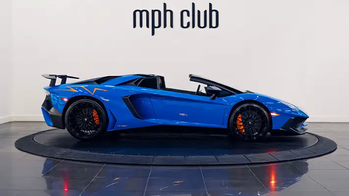 Blue Lamborghini Aventador SV Roadster rental side view - mph club