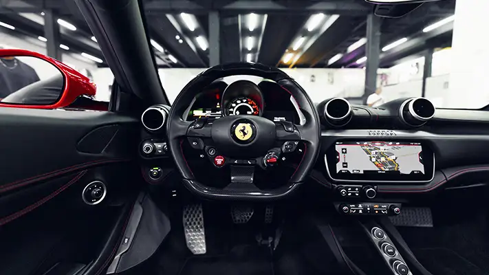 Red on black Ferrari Portofino rental dashboard view - mph club