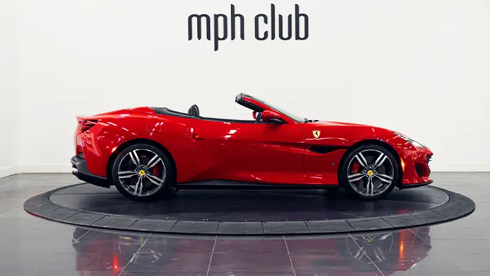 Red on black Ferrari Portofino rental side view - mph club