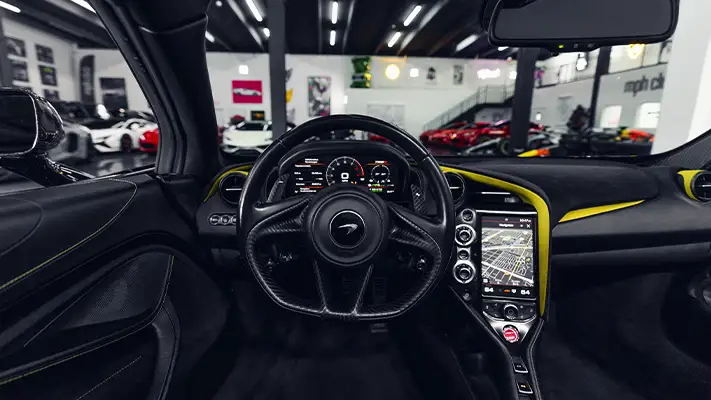 Black on yellow McLaren 720s Spider rental dashboard view - mph club