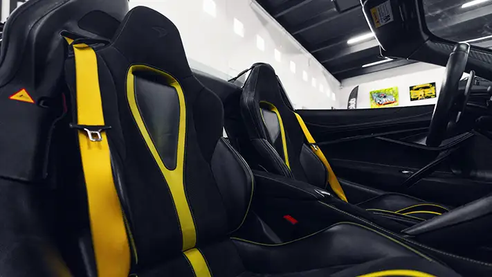 Black on yellow McLaren 720s Spider rental interior view - mph club