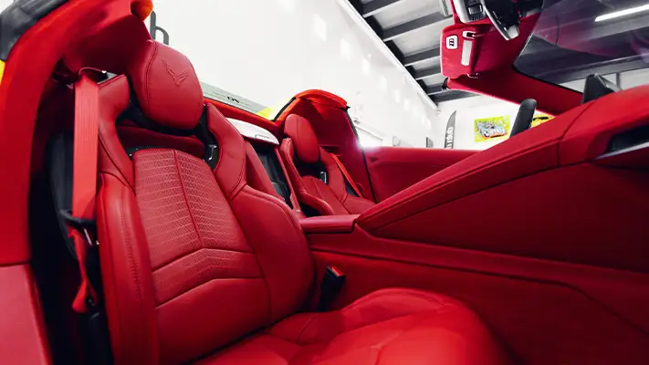 Yellow on red Chevrolet Corvette C8 rental interior view - mph club