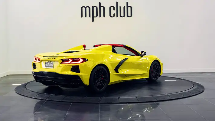 Yellow on red Chevrolet Corvette C8 rental rear view - mph club