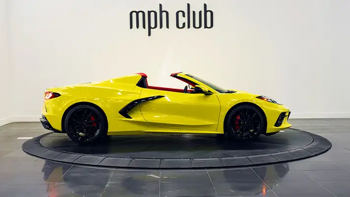 Yellow on red Chevrolet Corvette C8 rental side view - mph club