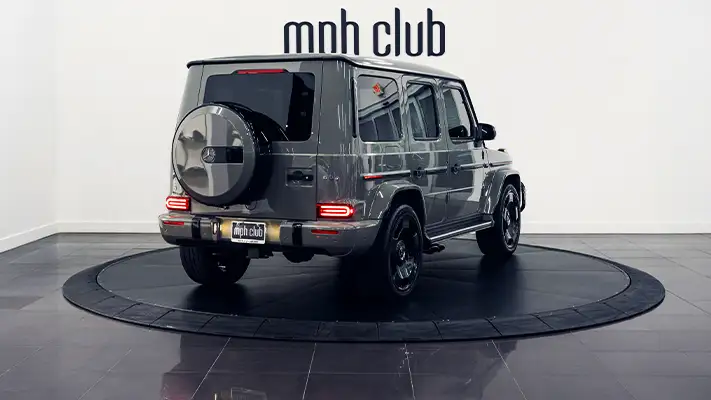 Gray Mercedes Benz G63 AMG G Wagon rental rear view - mph club