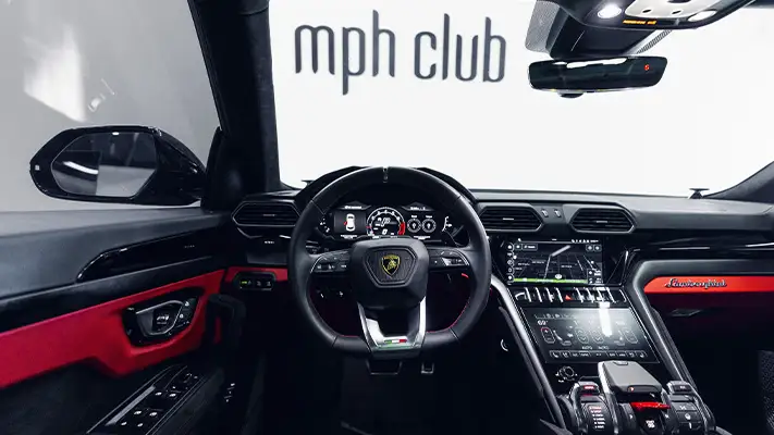 Black on red Lamborghini Urus rental dashboard view - mph club