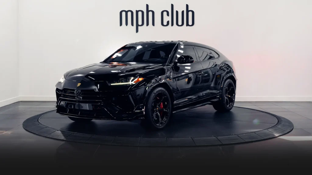 Black on red Lamborghini Urus rental profile view - mph club