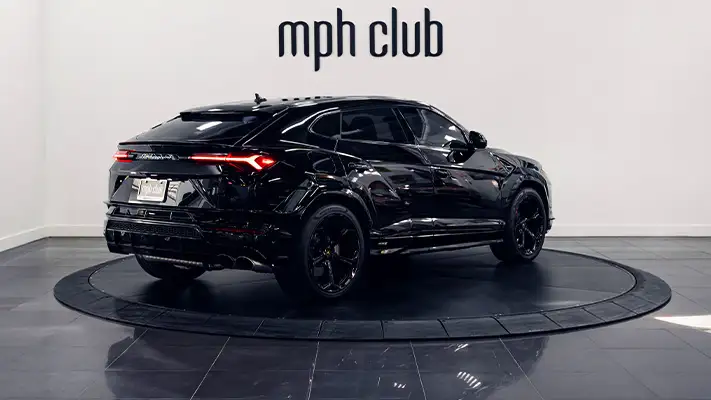 Black on red Lamborghini Urus rental rear view - mph club