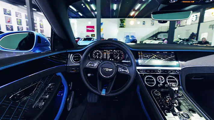 Blue Bentley Continental GTC Speed rental dashboard view - mph club