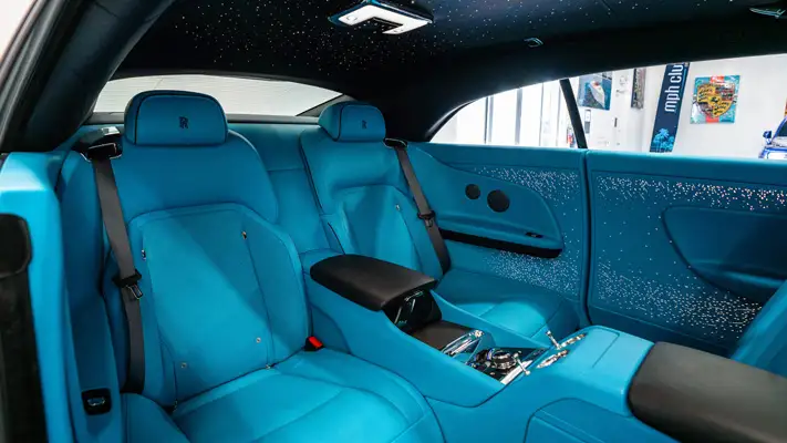 Grey on blue Rolls Royce Spectre rental interior view - mph club