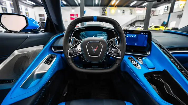 Blue on blue Chevrolet Corvette C8 rental dashboard view - mph club