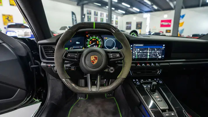 Green Porsche 911 Carrera T rental dashboard view - mph club