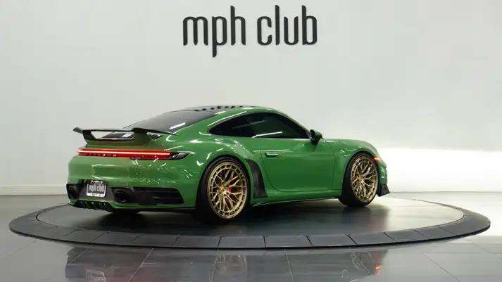 Green Porsche 911 Carrera T rental rear view - mph club