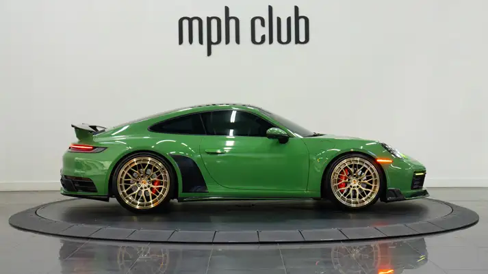 Green Porsche 911 Carrera T rental side view - mph club