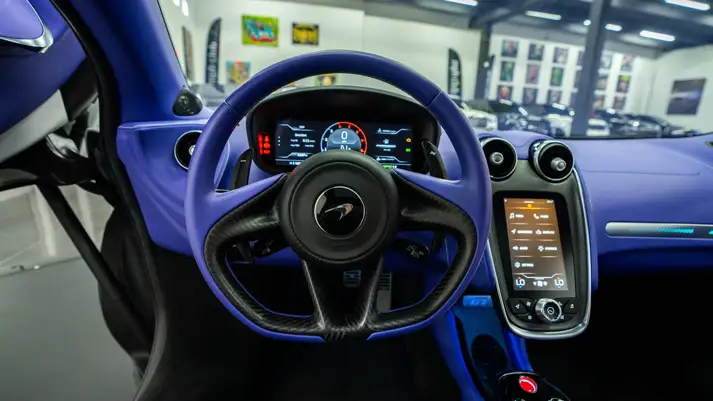 White McLaren GT rental dashboard view - mph club