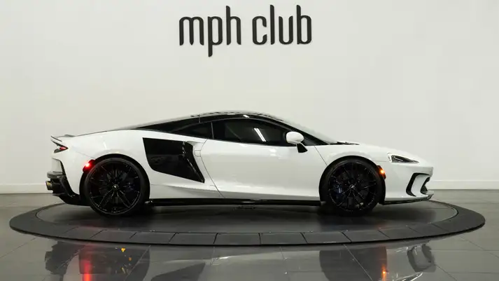 White McLaren GT rental side view - mph club