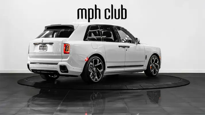 White on blue Rolls Royce Cullinan Black Badge for rent rear view - mph club