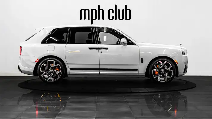 White on blue Rolls Royce Cullinan Black Badge for rent side view - mph club