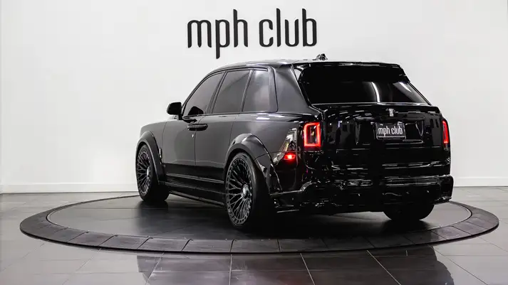 Black Rolls Royce Cullinan Widebody rental rear view - mph club