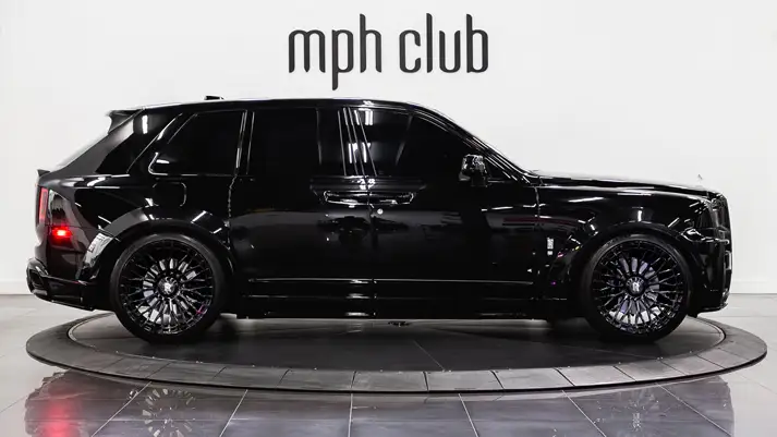 Black Rolls Royce Cullinan Widebody rental side view - mph club