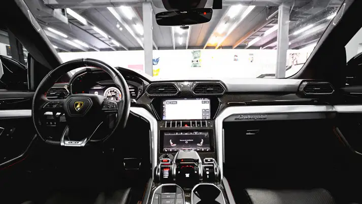 Black on black Lamborghini Urus rental dashboard view - mph club