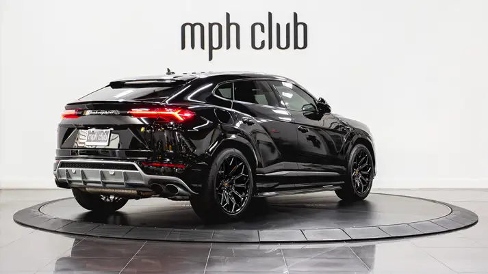 Black on black Lamborghini Urus rental rear view - mph club