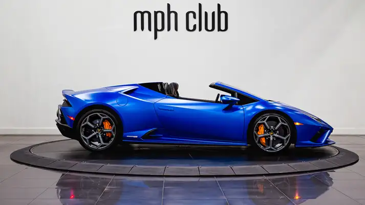 Blue Matte on black Lamborghini Huracan EVO Spyder rental side view - mph club