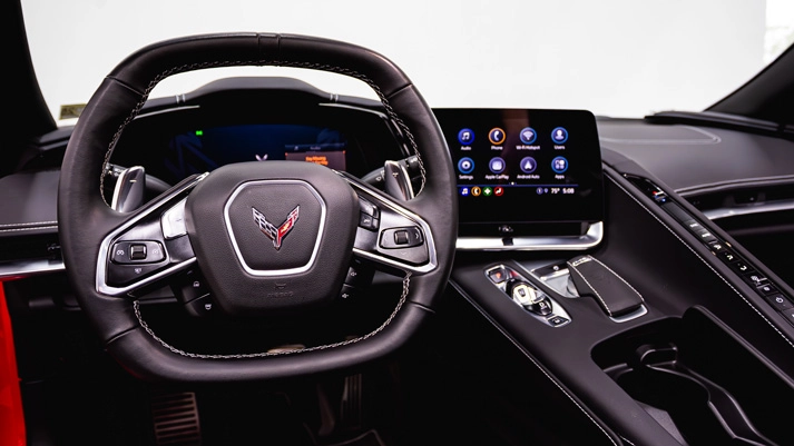 Red on black Chevrolet Corvette C8 rental dashboard view - mph club