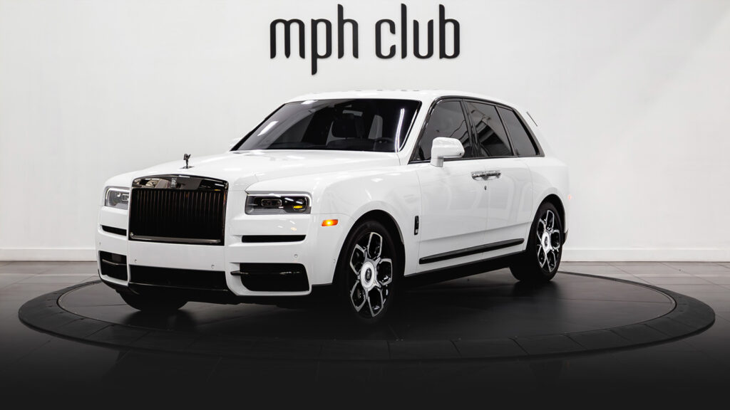 White on blue Rolls Royce Cullinan Black Badge rental profile view - mph club