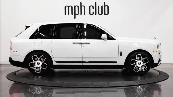 White on blue Rolls Royce Cullinan Black Badge rental side view - mph club