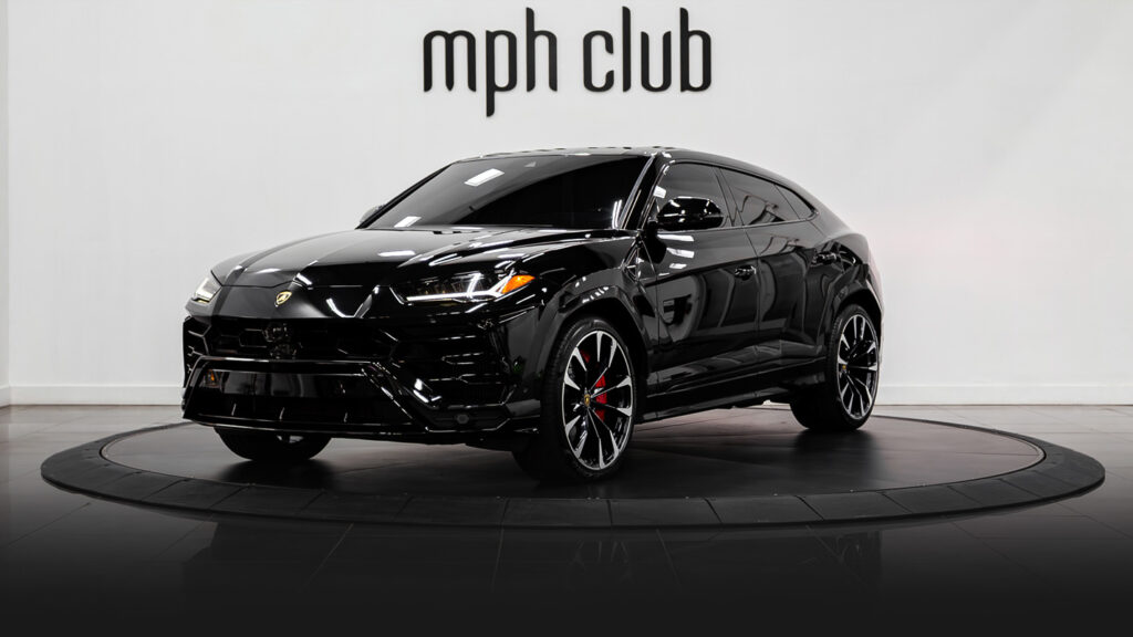 Black on red Lamborghini Urus for rent profile view - mph club