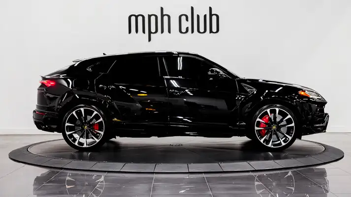 Black on red Lamborghini Urus for rent side view - mph club