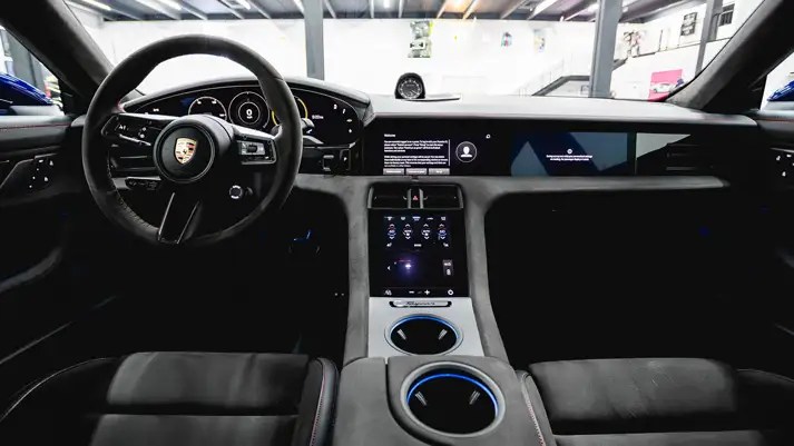 Blue Porsche Taycan rental dashboard view - mph club