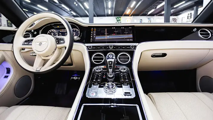 White on white Bentley Continental GTC rental dashboard view - mph club