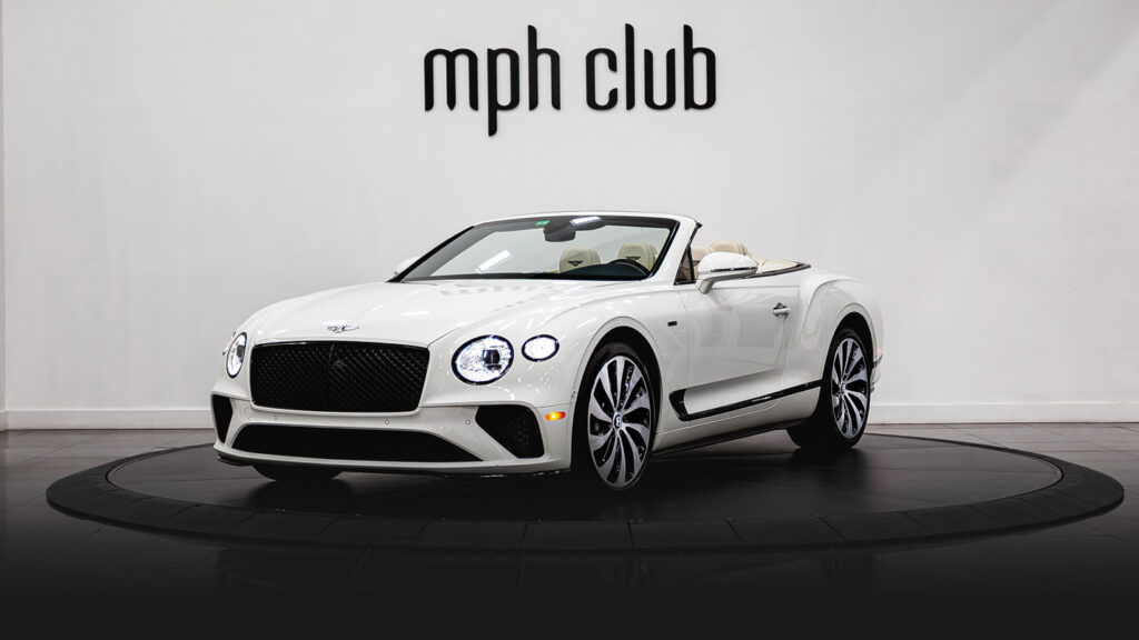 White on white Bentley Continental GTC rental profile view - mph club