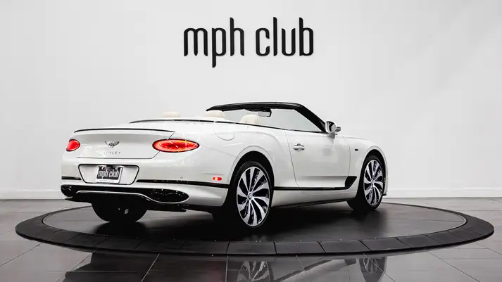 White on white Bentley Continental GTC rental rear view - mph club