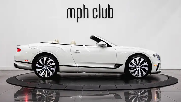 White on white Bentley Continental GTC rental side view - mph club