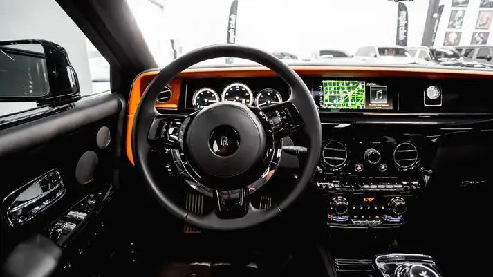 Black on orange Rolls Royce Phantom rental dashboard view - mph club