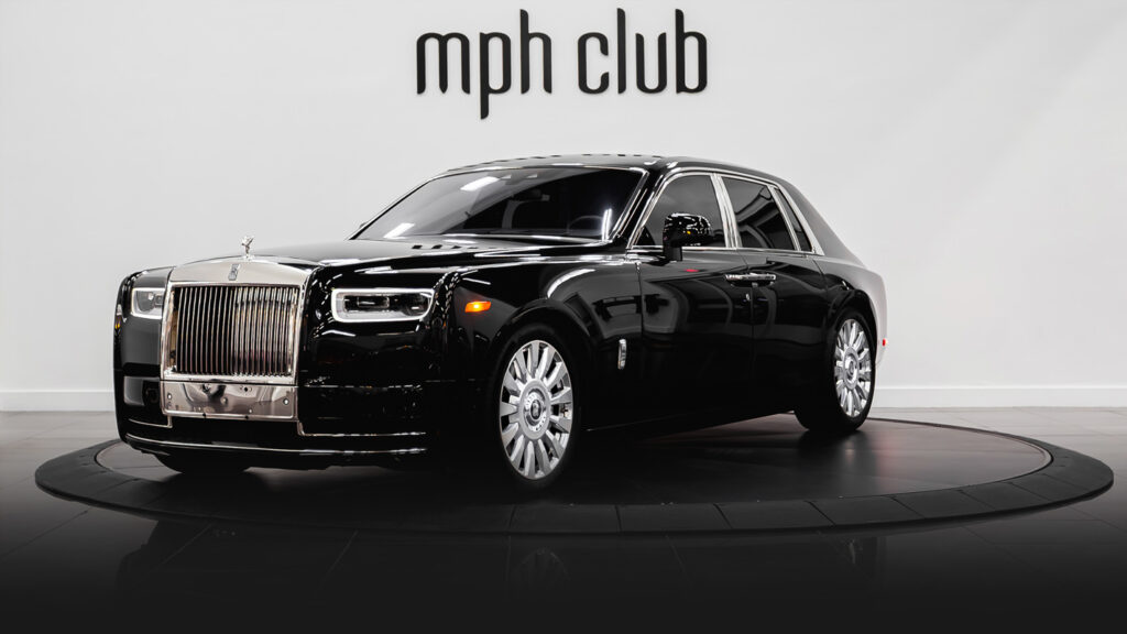 Black on orange Rolls Royce Phantom rental profile view - mph club