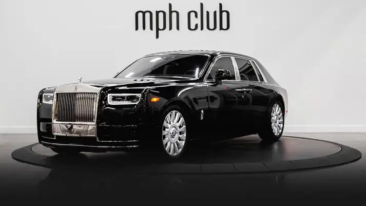 Black on orange Rolls Royce Phantom rental profile view rszd - mph club