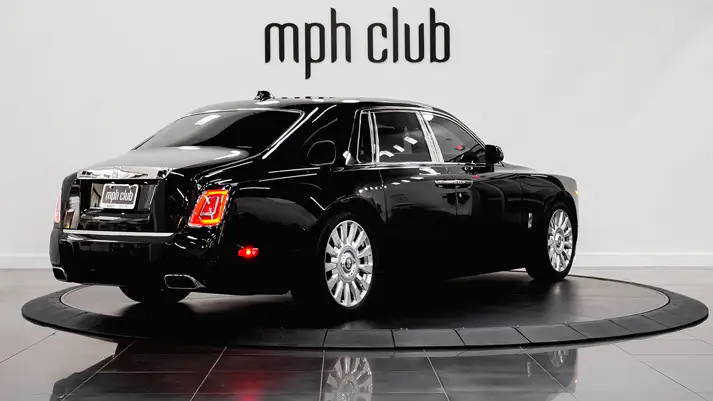 Black on orange Rolls Royce Phantom rental rear view - mph club