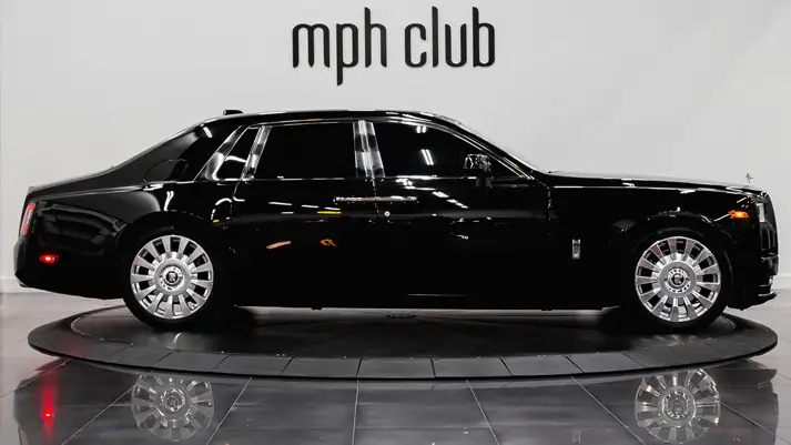 Black on orange Rolls Royce Phantom rental side view - mph club