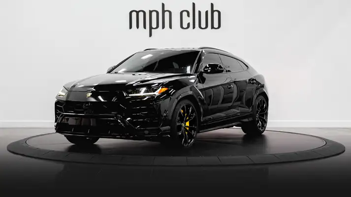 Black on yellow Lamborghini Urus rental profile view rszd - mph club